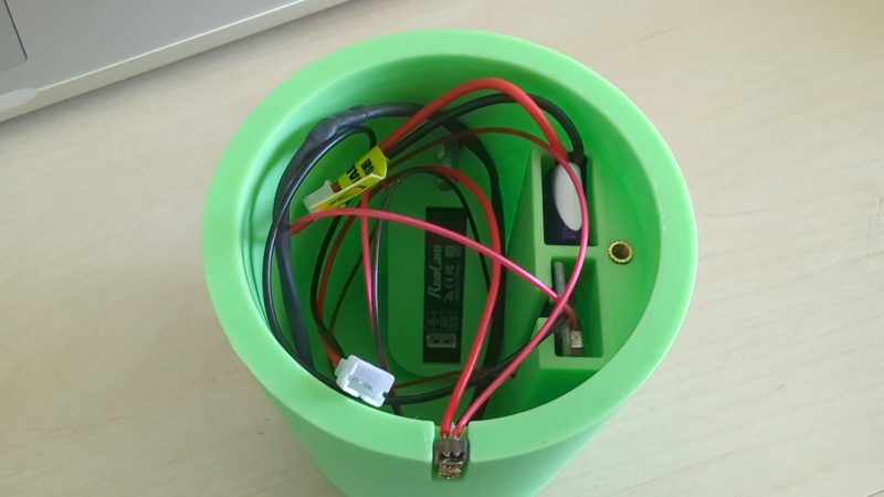 Inside the green camera module housing