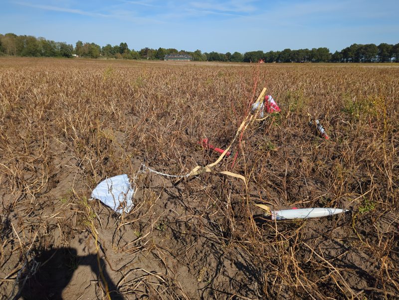 The rocket on the ground, spread out along its shock cords with both chutes